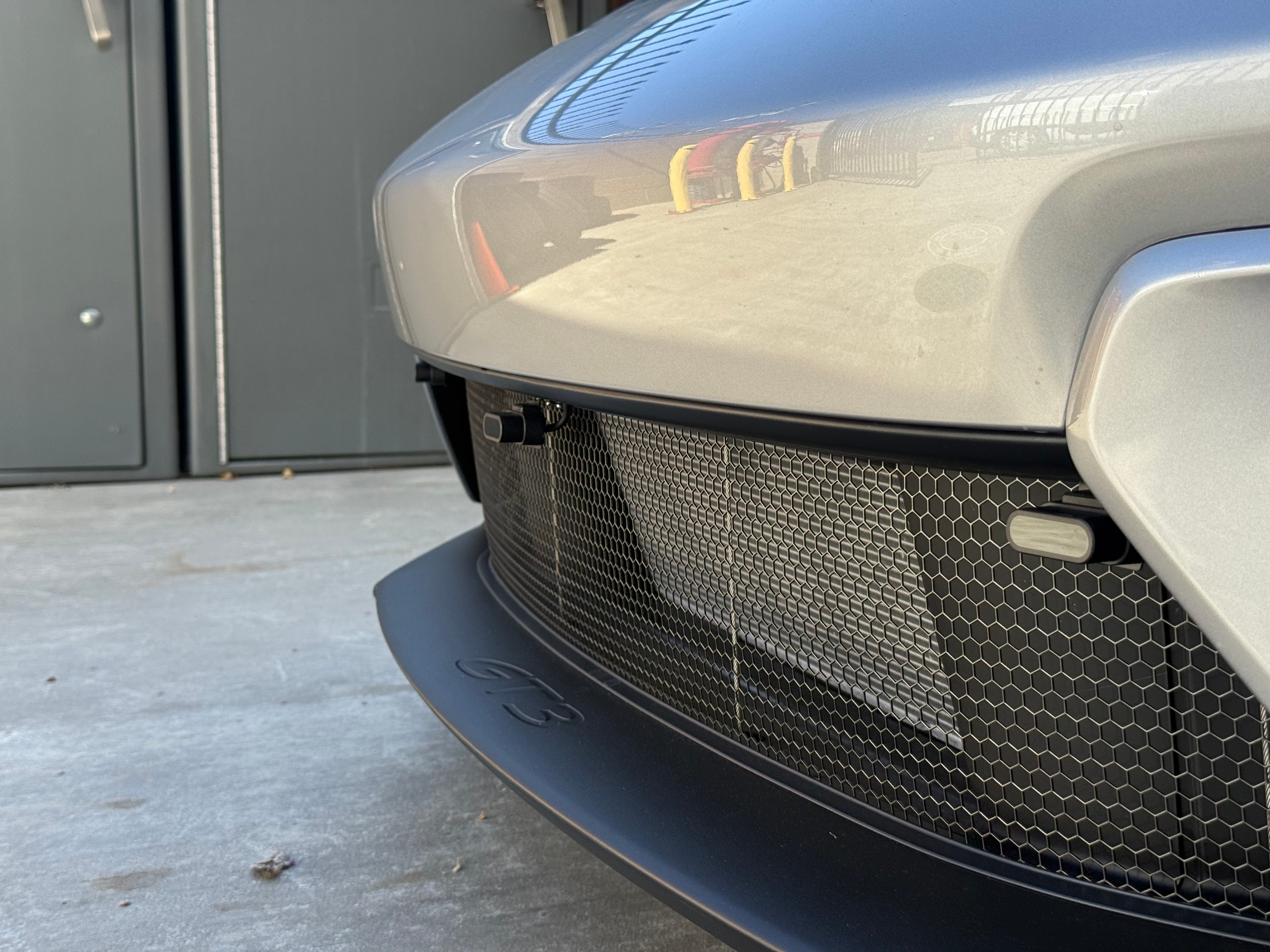 Porsche GT3 lower front angle — dual ZR6 laser shifter heads in grille